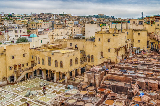 Old tanks of the Fez tanneries with color paint for leather, Morocco.