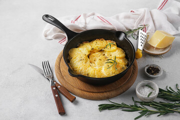 Potato gratin in black pan