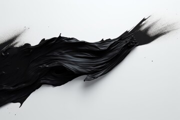 Black paint texture, abstract light texture, splash of paint on a light background