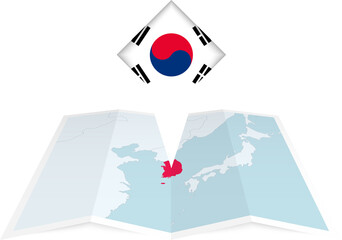 South Korea pin flag and map on a folded map