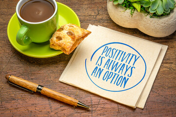 Positivity is always an option - inspirational reminder note on a napkin with coffee, positive...