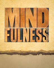 mindfulness word abstract  -  awareness concept - text in letterpress wood type on art paper, vertical poster