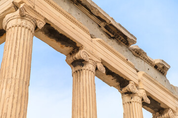 Fototapeta premium Antique columns of Erechtheion temple, Acropolis of Athens, Greece. Erechtheum is an ancient Greek Ionic temple of Athena Polias in Greece. Popular travel destination