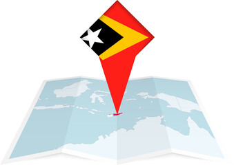 Naklejka premium East Timor pin flag and map on a folded map