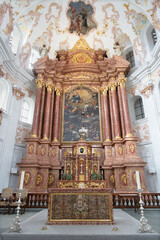 LUZERN, SWITZERLAND - JULY 24, 2022: The main altar of Jesuit church (by Christoph Bruck and  Heinrik Mayers) with painting of Glory of St. Francis Xavier by Francesco Innocenzo Toriani (1681). - 705935863