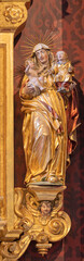 LUZERN, SWITZERLAND - JULY 24, 2022: The carved polychrome statue of St. Ann in the church St. Leodegar im Hof (altar of Dormition of Virgin Mary) by Niklaus Geisler (1585-1665).