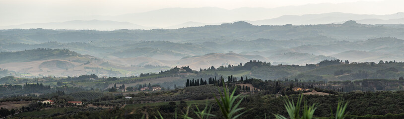 Typical Tuscan landscape in val d Elsa with hills and cypresses in the very early morning
