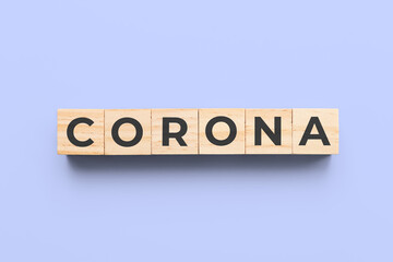 corona wooden cubes on blue background