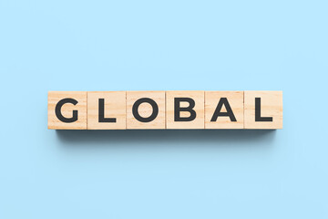 global wooden cubes on blue background