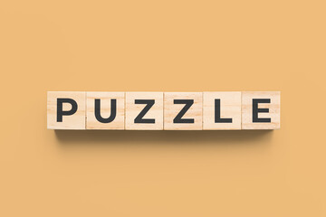 puzzle wooden cubes on orange background