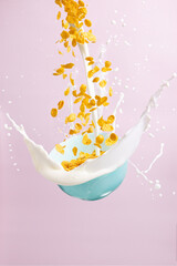  cornflakes fly into the plate, the milk is poured with splashes morning breakfast