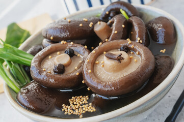 Boiled shiitake marinated with spices close-up. Mushrooms prepared for further cooking