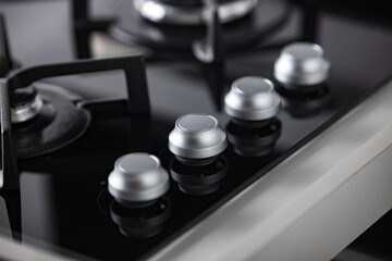 gray hob control knobs, shallow depth of field