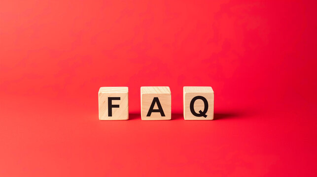 Isolated wooden blocks forming 'FAQ' on a sleek red background, providing a visually appealing and easily accessible Frequently Asked Questions section