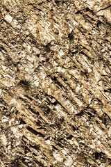 Talloires, France - September 08 2020 : creepy cracks, moss and linches on historic old errodated walls