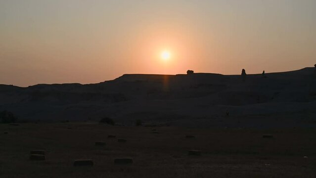 Unique rock forms in the middle of deserted nature with sunset colors and clouds in the sky