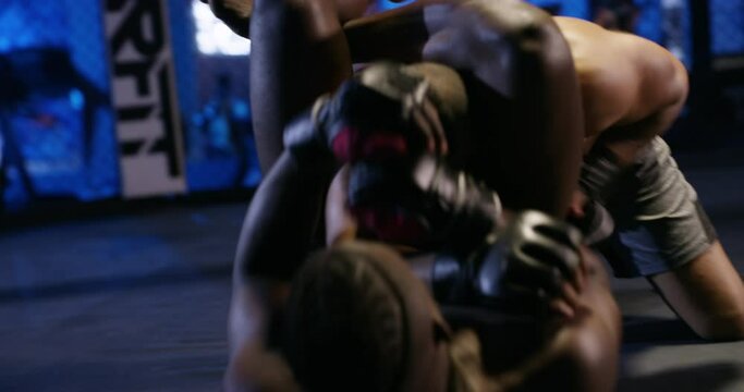 Men, boxers and fighting in ring, competition and mma in battle, boxing and strong. Attack, sports and arm muscles for power, self defense and concentration for challenge professional and athlete