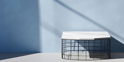 Minimal corner table with white marble and net shadow on blue concrete wall background, perfect for product presentation and display.