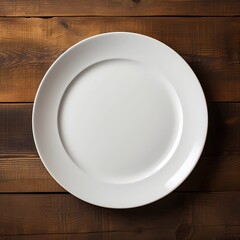 A white empty plate without anything lies on the table, top view. Template, mockup