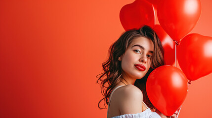 a woman holding red balloons - Powered by Adobe