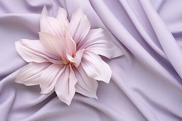 a flower on a purple cloth