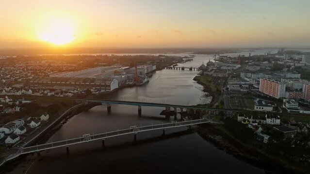 Lorient's river gateway bathed in dawn light.