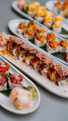 japanese sushi food. Maki ands rolls with tuna, salmon, shrimp, crab and avocado. Rainbow sushi roll, uramaki, hosomaki and nigiri. 