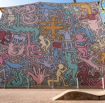 PISA, ITALY - SEPTEMBER 17, 2023 -Famous wall painting Tuttomondo from Keith Haring