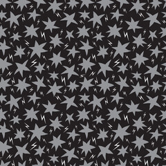 Hand-drawn gray stars and white lightning bolts on black background seamless pattern