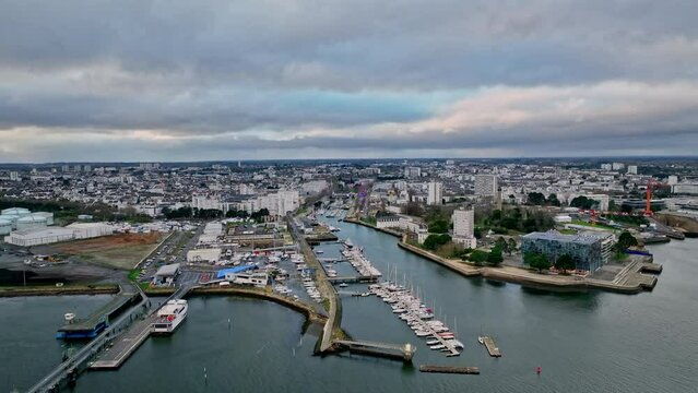 Lorient's shipping port under a breaking storm.