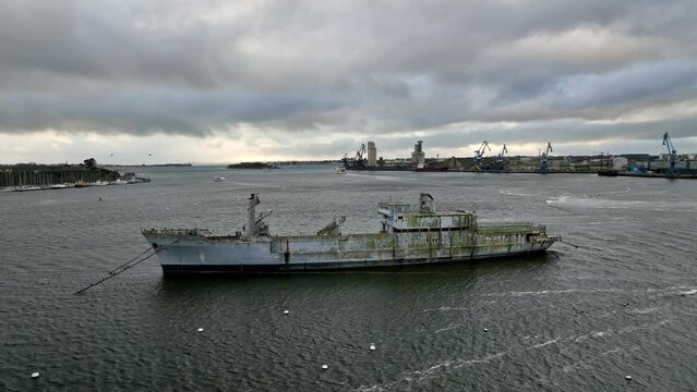 Abandoned ship hosts a game in Lorient harbor.