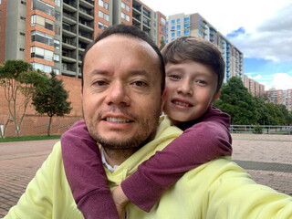 Young man having fun with his little brother