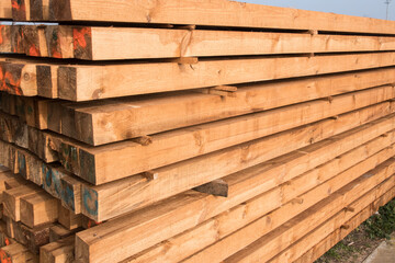 Stacked wooden pine beams closeup 