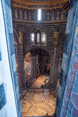 Fototapeta premium SIENA, ITALY - SEPTEMBER 23, 2023 - View to the nave of the Siena cathedral through an upper window
