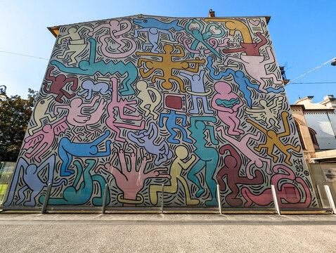 PISA, ITALY - SEPTEMBER 17, 2023 - Wall painting Tuttomondo from Keith Haring