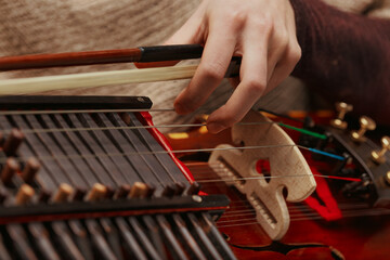 Traditional Nyckelharpa keys resonate with folk tunes