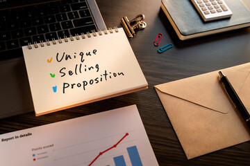 There is notebook with the word Unique Selling Proposition. It is as an eye-catching image.