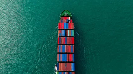 Foto auf Acrylglas global business transportation, cargo logistic container ship sailing in sea  import export goods and distributing products to dealer and consumers worldwide, top view © SHUTTER DIN