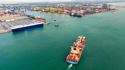 Fotobehang logistic cargo container ship sailing in sea to import export goods and distributing products to dealer and consumers across worldwide © SHUTTER DIN