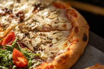 Fresh capricciosa pizza, close up