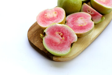 Fresh pink guava on white background.