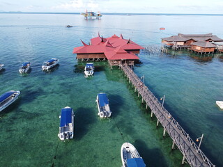 Drone view of Mabul Island, the base for diving in Sipadan Island, Sabah state in Malaysia.