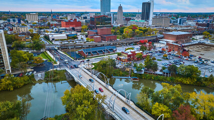 Aerial View of Fall Foliage in Urban Fort Wayne with River and Bridges