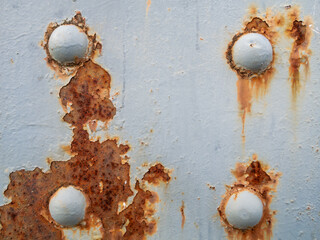 Metallic Contrasts: Gray Texture with Oxidation and Prominent Rivets.
