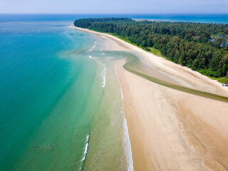 Drone view of a large, deserted tropical sandy beach and shallow, warm ocean (Memories Beach, Khao Lak, Thailand)