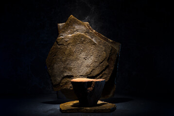 stones and ice for the podium. natural brown stones in a thin layer of ice on a dark background for...