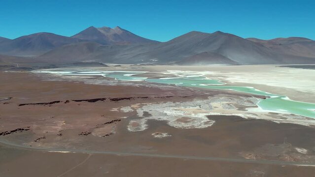 Beautiful aerial footage of the Atacama - Calama - Antofagasta Dessert and Salar - turquoise lagoon 