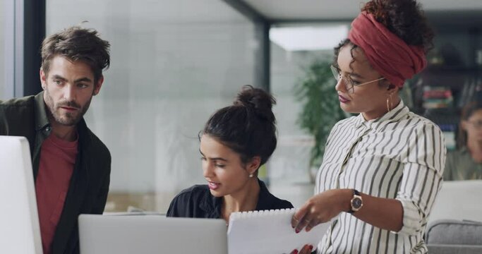 Business people, computer and coworking in office together, discussion and paperwork for plan. Staff, communication and brainstorming or creative problem solving, teamwork and diversity or support