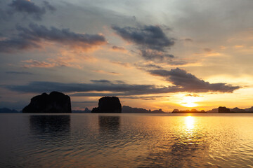 Fototapeta premium Beautiful ocean landscape in Krabi province, Thailand. Limestone cliffs in the sea at sunset.