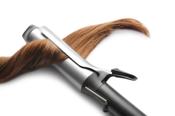 Curling iron with brown hair lock isolated on white